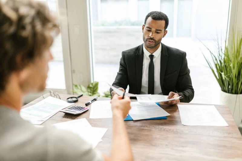 Consultant reviewing candidate documentation with a client